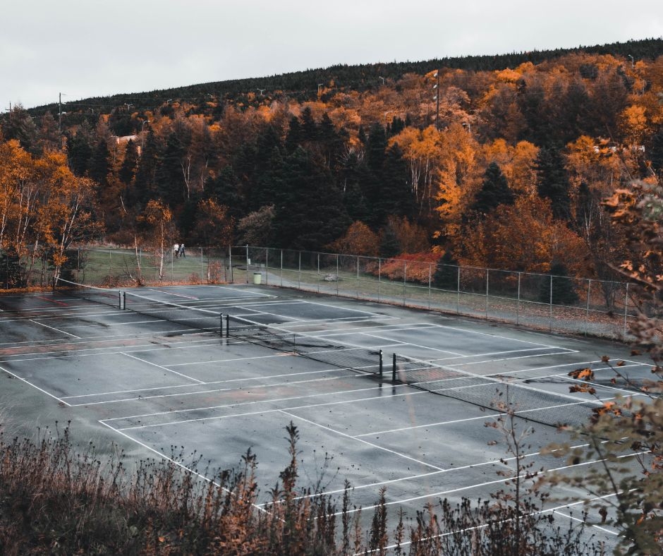 How does professional tennis court cleaning improve playability?