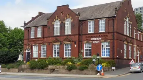 Steve Bruce's infant grandson died after an ‘unsafe sleeping position’, coroner's court told.