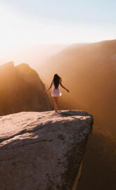 Girl on edge of cliff