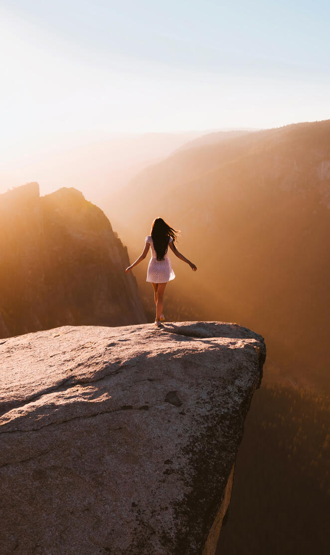 Girl on edge of cliff
