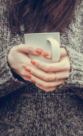 Cup in female hands