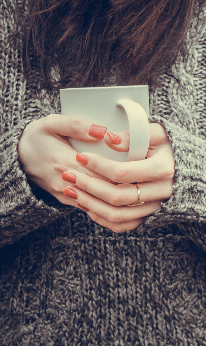 Cup in female hands