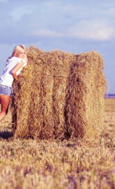 Girl At Hay Rolls