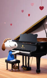 a toy figurine next to a piano