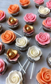 a group of cupcakes with pink frosting