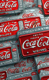 a pile of red and white soda cans