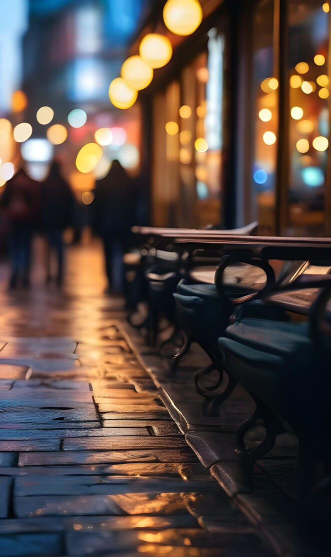 a row of benches on a sidewalk