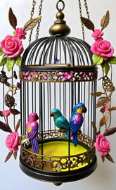 a bird cage with birds in it