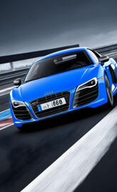 a blue sports car on a race track