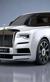 a white car with a black grill
ROLLS ROYCE